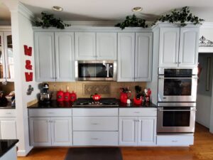 Kitchen area in a home in Richmond, VA with white cabinets