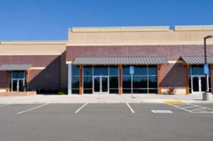 Exterior of light brown and red brick retail building in Richmond, VA