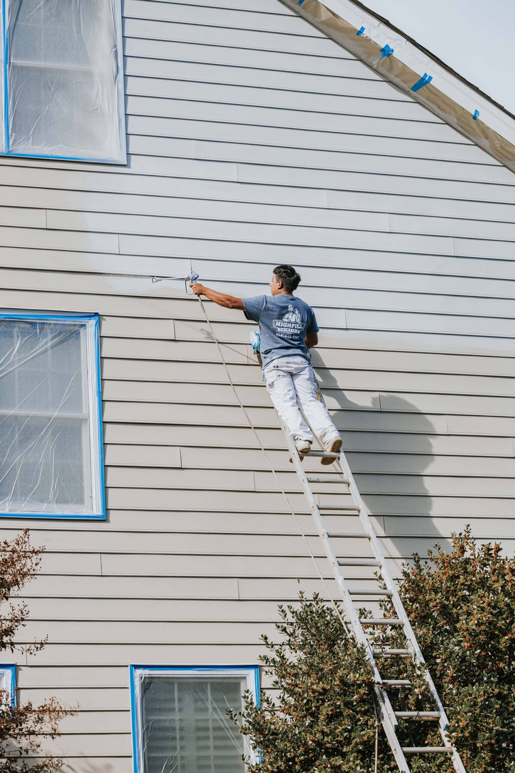 About 17 Highfill worker painting the outside of a home in Richmond, VA.